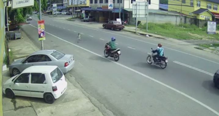 VIDEO: Motorcyclist Saves Child Running Across Busy Street